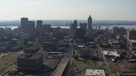 5.7K aerial stock footage fly away from tall high-rise office buildings in the Downtown Memphis, Tennessee skyline, descend Aerial Stock Footage | DX0002_179_037
