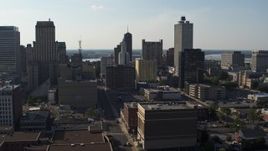 5.7K aerial stock footage descend and approach Lincoln American Tower by taller office buildings in Downtown Memphis, Tennessee Aerial Stock Footage | DX0002_180_005