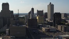 5.7K aerial stock footage focus on Lincoln American Tower, ascend past taller office buildings in Downtown Memphis, Tennessee Aerial Stock Footage | DX0002_180_006