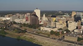 5.7K aerial stock footage of passing by office buildings near Wolf River Harbor in Downtown Memphis, Tennessee Aerial Stock Footage | DX0002_180_015