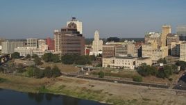 5.7K aerial stock footage approach and fly away from Raymond James Tower from Wolf River Harbor, Downtown Memphis, Tennessee Aerial Stock Footage | DX0002_180_017