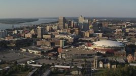 5.7K aerial stock footage of a view of FedEx Forum arena and the city skyline at sunset, Downtown Memphis, Tennessee Aerial Stock Footage | DX0002_180_023