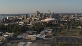 5.7K aerial stock footage of a view of the city skyline and FedEx Forum arena during descent, Downtown Memphis, Tennessee, sunset Aerial Stock Footage | DX0002_180_026