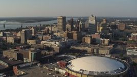 5.7K aerial stock footage flyby the city skyline and FedEx Forum arena at sunset, Downtown Memphis, Tennessee Aerial Stock Footage | DX0002_180_029
