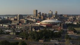 5.7K aerial stock footage the city skyline and FedEx Forum arena at sunset during descent, Downtown Memphis, Tennessee Aerial Stock Footage | DX0002_180_031