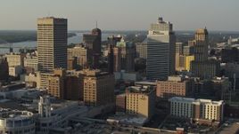 5.7K aerial stock footage fly away from office towers at sunset in Downtown Memphis, Tennessee Aerial Stock Footage | DX0002_180_039