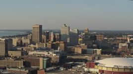5.7K aerial stock footage of office towers at sunset seen from the arena, Downtown Memphis, Tennessee Aerial Stock Footage | DX0002_180_040