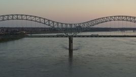 5.7K aerial stock footage a view of traffic crossing the Hernando de Soto Bridge at sunset, Downtown Memphis, Tennessee Aerial Stock Footage | DX0002_181_018