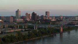 5.7K aerial stock footage focus on the city's skyline as traffic crosses the bridge at sunset, Downtown Memphis, Tennessee Aerial Stock Footage | DX0002_181_020