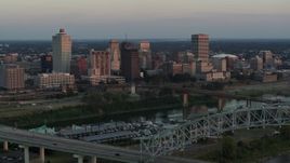5.7K aerial stock footage of the city's skyline seen from the Hernando de Soto Bridge at sunset in Downtown Memphis, Tennessee Aerial Stock Footage | DX0002_181_023