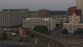 5.7K aerial stock footage of orbit Memphis City Hall at sunset in Downtown Memphis, Tennessee Aerial Stock Footage | DX0002_181_036