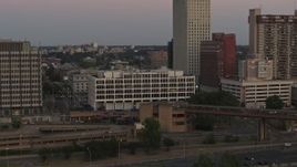 5.7K aerial stock footage of a reverse view of Memphis City Hall at sunset in Downtown Memphis, Tennessee Aerial Stock Footage | DX0002_181_037