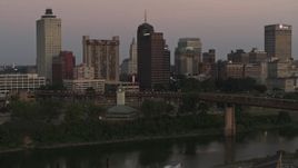 5.7K aerial stock footage fly away from and by apartment and office high-rises at sunset in Downtown Memphis, Tennessee Aerial Stock Footage | DX0002_181_038