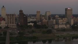 5.7K aerial stock footage a view across the river at the skyline at sunset in Downtown Memphis, Tennessee Aerial Stock Footage | DX0002_181_041