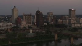 5.7K aerial stock footage a view across the river at the city's skyline at sunset in Downtown Memphis, Tennessee Aerial Stock Footage | DX0002_181_042