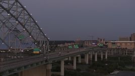 5.7K aerial stock footage passing the Memphis side of the Hernando de Soto Bridge at twilight, Downtown Memphis, Tennessee Aerial Stock Footage | DX0002_181_047