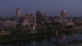 5.7K aerial stock footage a stationary view across the river at the city's skyline at twilight in Downtown Memphis, Tennessee Aerial Stock Footage | DX0002_182_001