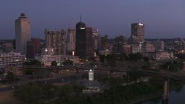 5.7K aerial stock footage of flying by the city's skyline across the river at twilight in Downtown Memphis, Tennessee Aerial Stock Footage | DX0002_182_003