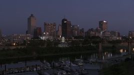 5.7K aerial stock footage of a view of downtown from across the river at twilight during descent, Downtown Memphis, Tennessee Aerial Stock Footage | DX0002_182_008