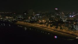 5.7K aerial stock footage of approaching downtown office buildings at night, Downtown Memphis, Tennessee Aerial Stock Footage | DX0002_182_018
