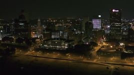 5.7K aerial stock footage of flying by office buildings at night in Downtown Memphis, Tennessee Aerial Stock Footage | DX0002_182_019