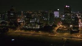 5.7K aerial stock footage of flying by office buildings and towers at night in Downtown Memphis, Tennessee Aerial Stock Footage | DX0002_182_020