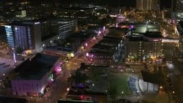 5.7K aerial stock footage a view of Beale Street and BB King Boulevard intersection at night in Downtown Memphis, Tennessee Aerial Stock Footage | DX0002_182_043