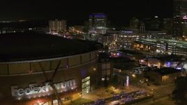 5.7K aerial stock footage stationary view of FedEx Forum and Beale Street clubs at night in Downtown Memphis, Tennessee Aerial Stock Footage | DX0002_182_050