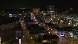 5.7K aerial stock footage flyby FedEx Forum to reveal Beale Street clubs at night in Downtown Memphis, Tennessee Aerial Stock Footage | DX0002_182_051