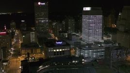 5.7K aerial stock footage flyby One Commerce Square and First Tennessee Building at night, reveal Monroe Avenue, Downtown Memphis, Tennessee Aerial Stock Footage | DX0002_182_052