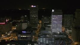 5.7K aerial stock footage of One Commerce Square and First Tennessee Building at night by Monroe Avenue, Downtown Memphis, Tennessee Aerial Stock Footage | DX0002_182_053