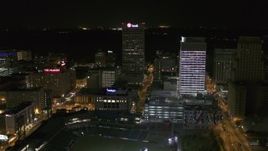 5.7K aerial stock footage fly away from and orbit One Commerce Square and First Tennessee Building at night by Monroe Avenue, Downtown Memphis, Tennessee Aerial Stock Footage | DX0002_182_054