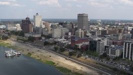 5.7K aerial stock footage of panning to office buildings near the water, Downtown Memphis, Tennessee Aerial Stock Footage | DX0002_183_002