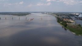 5.7K aerial stock footage a stationary view of the Hernando de Soto Bridge and Mississippi River, Memphis, Tennessee Aerial Stock Footage | DX0002_183_009