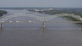 5.7K aerial stock footage slowly orbit the Hernando de Soto Bridge as traffic crosses the span, Memphis, Tennessee Aerial Stock Footage | DX0002_183_028