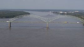 5.7K aerial stock footage reverse view of the Hernando de Soto Bridge as traffic crosses the span, Memphis, Tennessee Aerial Stock Footage | DX0002_183_029