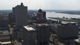 5.7K aerial stock footage of office high-rise behind a county building and police station in Downtown Memphis, Tennessee Aerial Stock Footage | DX0002_184_012