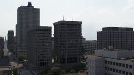 5.7K aerial stock footage descend by a county building and police station in Downtown Memphis, Tennessee Aerial Stock Footage | DX0002_184_015