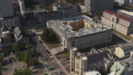 5.7K aerial stock footage reverse view of courthouse by a church, Downtown Memphis, Tennessee Aerial Stock Footage | DX0002_184_024