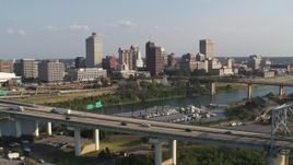 5.7K aerial stock footage focus on skyline while flying by the bridge, Downtown Memphis, Tennessee Aerial Stock Footage | DX0002_185_005