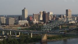 5.7K aerial stock footage of approaching the skyline behind the bridge at sunset, Downtown Memphis, Tennessee Aerial Stock Footage | DX0002_185_030