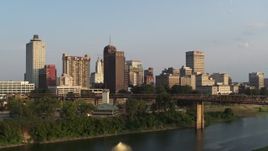 5.7K aerial stock footage approach the downtown skyline at sunset, orbit city buildings, Downtown Memphis, Tennessee Aerial Stock Footage | DX0002_186_001