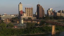 5.7K aerial stock footage orbit welcome center, bridge, apartment complex and office tower at sunset, Downtown Memphis, Tennessee Aerial Stock Footage | DX0002_186_017