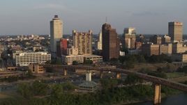5.7K aerial stock footage reverse view of apartment complex and neighboring office tower at sunset, Downtown Memphis, Tennessee Aerial Stock Footage | DX0002_186_019