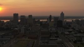 5.7K aerial stock footage orbit the city skyline and reveal setting sun, Downtown Memphis, Tennessee Aerial Stock Footage | DX0002_186_025