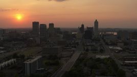 5.7K aerial stock footage a reverse view of the downtown skyline and the setting sun, Downtown Memphis, Tennessee Aerial Stock Footage | DX0002_186_028