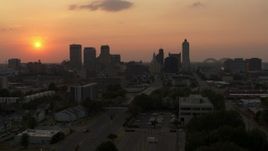 5.7K aerial stock footage of approaching the downtown skyline and the setting sun, Downtown Memphis, Tennessee Aerial Stock Footage | DX0002_186_029