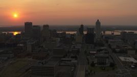 5.7K aerial stock footage of flying toward the downtown skyline and the setting sun, Downtown Memphis, Tennessee Aerial Stock Footage | DX0002_186_030