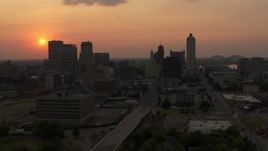 5.7K aerial stock footage fly away from the downtown skyline and the setting sun, then descent, Downtown Memphis, Tennessee Aerial Stock Footage | DX0002_186_031