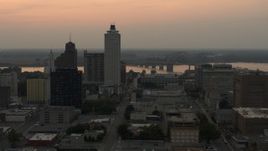 5.7K aerial stock footage flyby office towers at sunset, with view of river and bridge, Downtown Memphis, Tennessee Aerial Stock Footage | DX0002_186_037